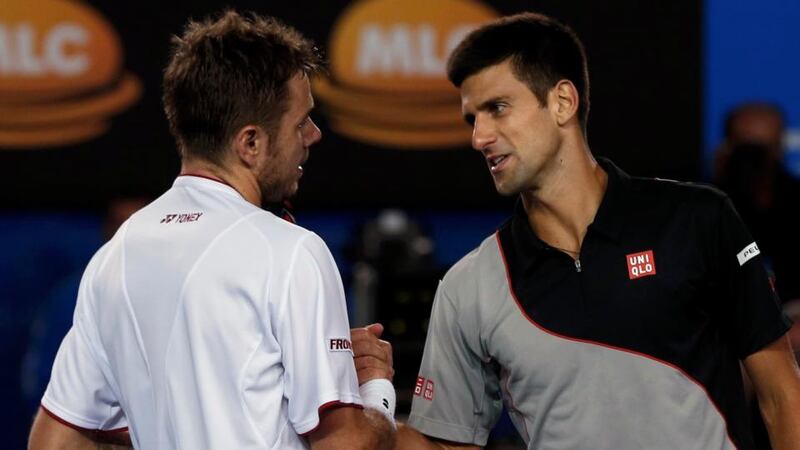 Stanislas Wawrinka of Switzerland shakes hands with Novak Djokovic (right) of Serbia  after winning their men’s singles quarter-final   at the Australian Open. Photograph: Bobby Yip/Reuters