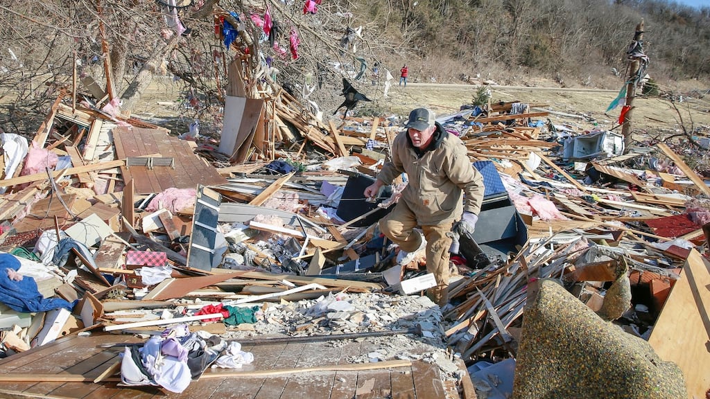Clean-up efforts were under way in Winterset, Iowa, on Sunday. Photograph: Bryon Houlgrave/The Des Moines Register via AP