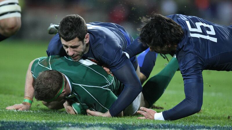Julien Malzieu and Clement Poitrenaud can’t prevent Jamie Heaslip scoring at Croke Park. Photograph: Billy Stickland/Inpho