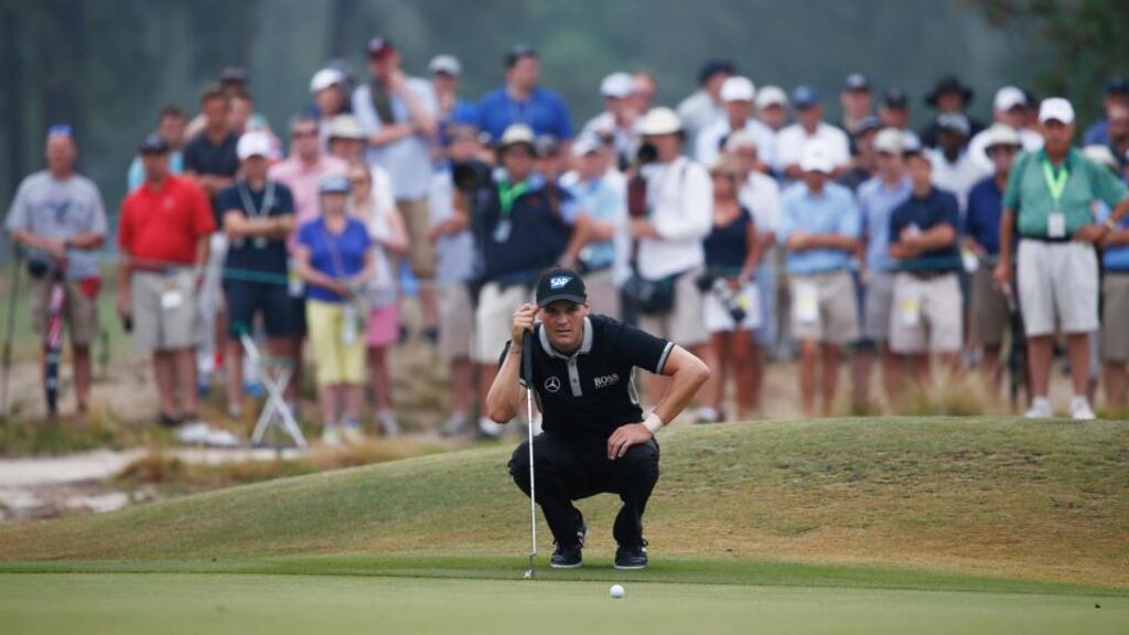 Martin Kaymer lines up a putt on the 11th hole during the second round of the US Open. Photograph: EPA