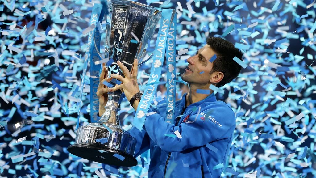 Serbia’s Novak Djokovic celebrates with the trophy after winning the Barclays ATP World Tour Finals against Switzerland’s Roger Federer. Photograph: Alex Morton/Reuters