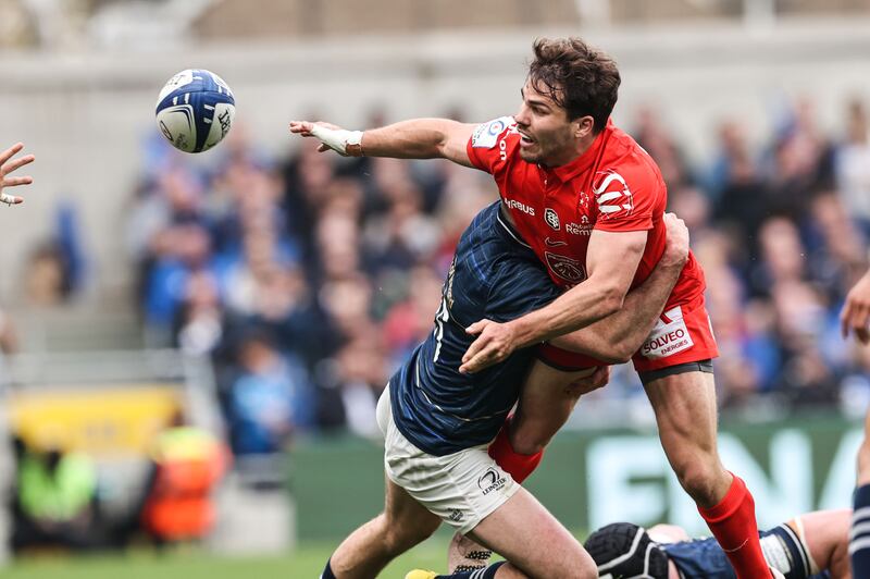 Toulouse’s Antoine Dupont offloading against Leinster in their Champions Cup semi-final at the Aviva Stadium on April 29th, 2023. Photograph: Billy Stickland/Inpho