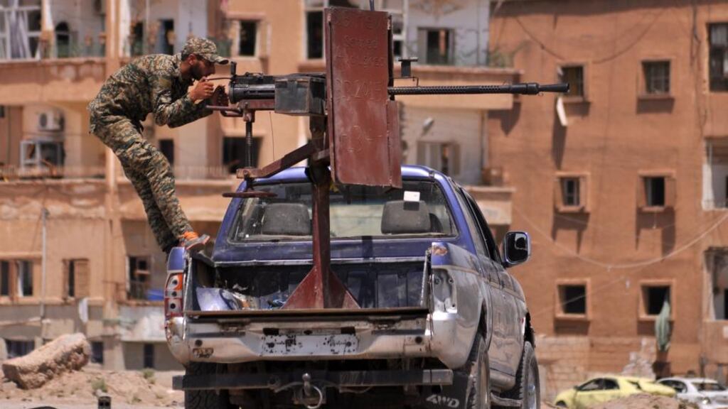 A member of the Kurdish People’s Protection Units (YPG) mans a mounted machine gun in the Al-Nashwa neighbourhood in the northeastern Syrian province of Hasakeh last month. Photograph: Getty Images