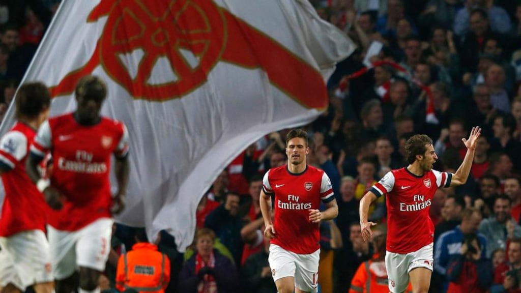 Arsenal’s Mathieu Flamini (right) celebrates scoring during their Premier League match against Manchester City at The Emirates Stadium. Photograph: Eddie Keogh/Reuters