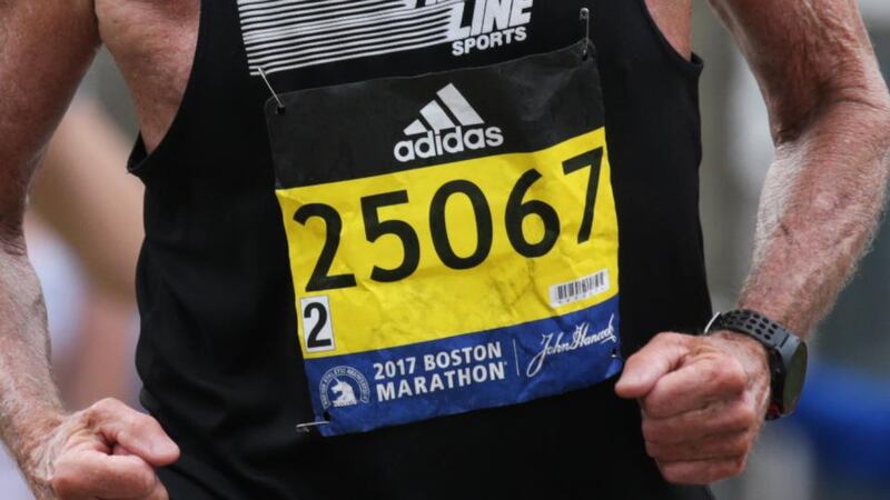 Every runner’s bib carries a microchip which registers at each of the checkpoints along the route. Photo: Getty Images
