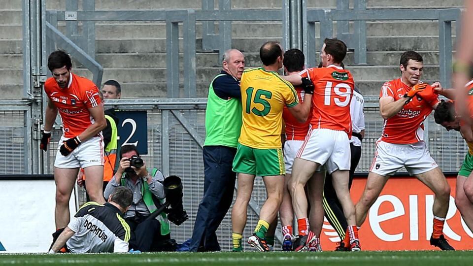 Armagh’s Aaron Findon pushes over the Donegal team doctor as a scuffle breaks out in front of Hill 16. Photograph: Donall Farmer/Inpho