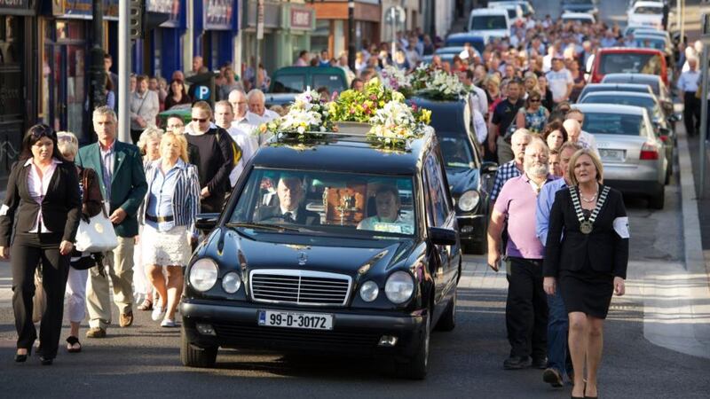 Castlebar falls silent in grief at removal of brothers to local church
