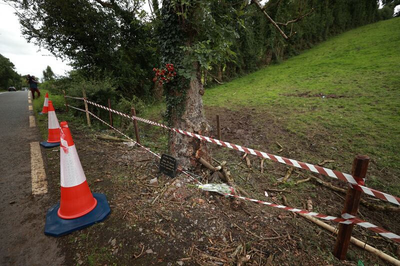 The scene of both crashes on the N54 Clones to Smithborough road at Legnakelly, Co. Monaghan. A plaque erected in memory of 20-year-old Ashley McCluskey can be seen at the foot of the tree. Photograph: Liam McBurney/PA Wire