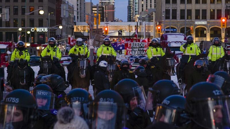 Police have begun an extensive operation to lock down the city center of Ottawa to clear the streets of demonstrators, along with dozens of semi-trailers. Photograph: James Park/Bloomberg