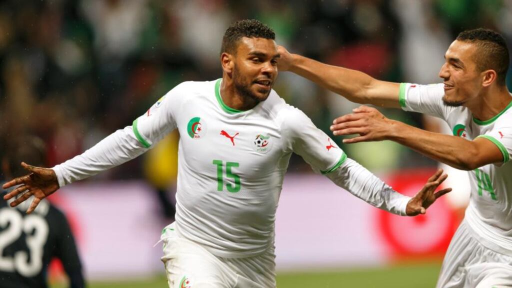Algeria’s El Arbi Hilal Soudani (left) celebrates his goal with fellow goalscorer against Romania Nabil Bentaleb. Photograph: Salvatore Di Nolfi / EPA