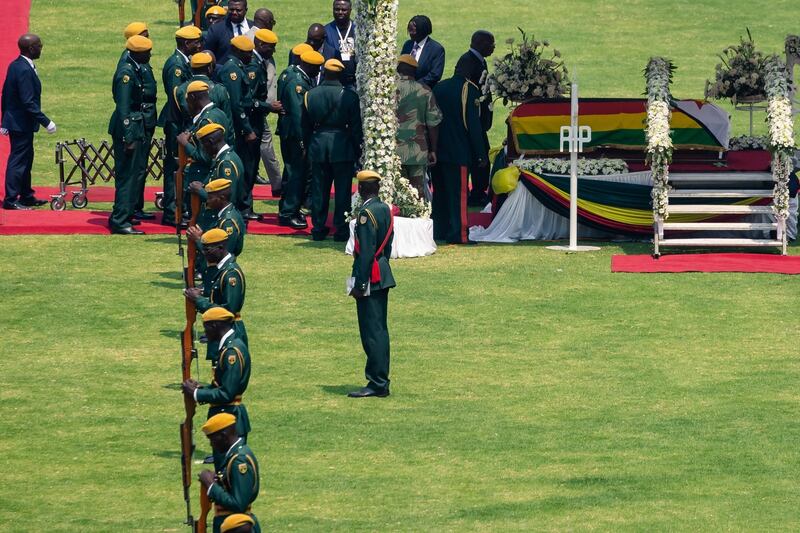 The coffin of Robert Mugabe is displayed during the funeral ceremony in Harare. Photograph: Photograph: Jekesai Njikizana/AFP/Getty