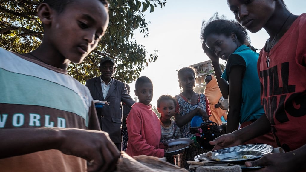 Displaced children from Western Tigray wait at meal time to receive food outside a classroom in the school where they are sheltering in Tigray’s capital, Mekelle, on February 24th. Photograph: Eduardo Soteras/AFP via Getty Images
