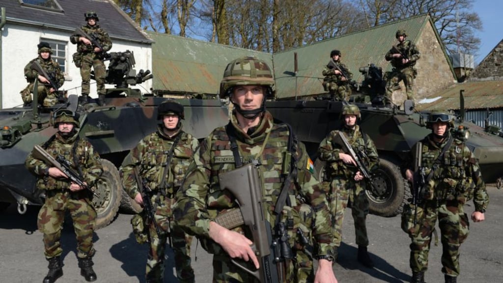 Ready to deploy: Lieut Col Mark Prendergast (centre) with Trooper Amy Crook, Sgt Maj Noel Callaghan, Capt Liam McDonnell, Cmdt Paul Kelly, Capt Phelim Carroll, Lieut Stephen Keane, Lieut Ronan O’Brien and Capt Cormac Brady at Camp Coolmoney, in the Glen of Imaal, before departing for UN duty in Syria. Photograph: Dara Mac Dónaill