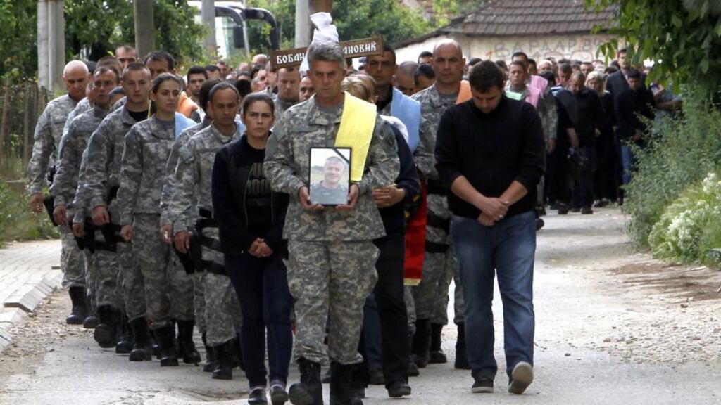 The funeral procession for Macedonian police officer Boban Ivanovic in the village of Stajkovci, just east of Skopje. Photograph: AP Photo/Boris Grdanoski