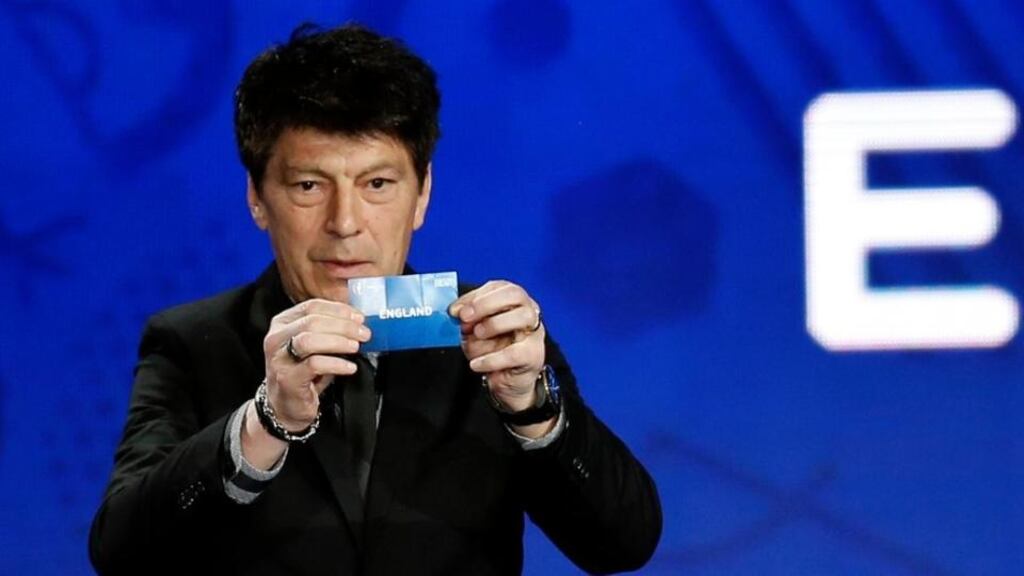 Former Russian goalkeeper Rinat Dasaev holds England aloft during the Uefa Euro 2016 qualifying draw in Nice. Photograph: Jean-Paul Pelissier/Reuters
