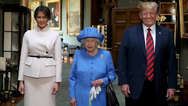 Britain’s Queen Elizabeth stands with US president Donald Trump and his wife Melania in the Grand Corridor during their visit to Windsor Castle on Friday. Photograph: Steve Parsons/Pool via Reuters