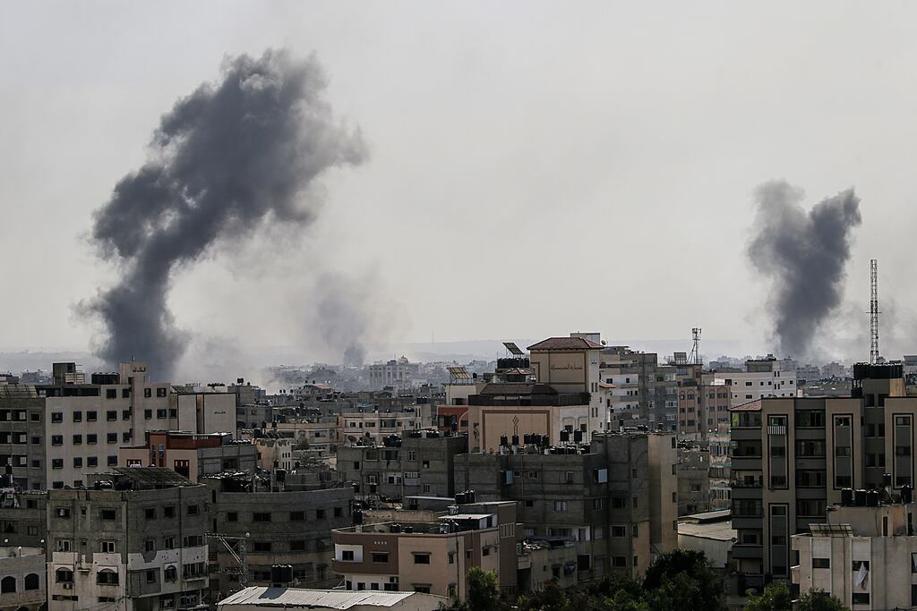 Smoke billows from residential buildings after Israeli air strikes in Gaza City. Photograph: Mohammed Saber/EPA