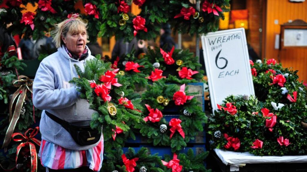 Bernie Darcy selling Christmas wreaths on Moore Street, Dublin. Photograph: Aidan Crawley