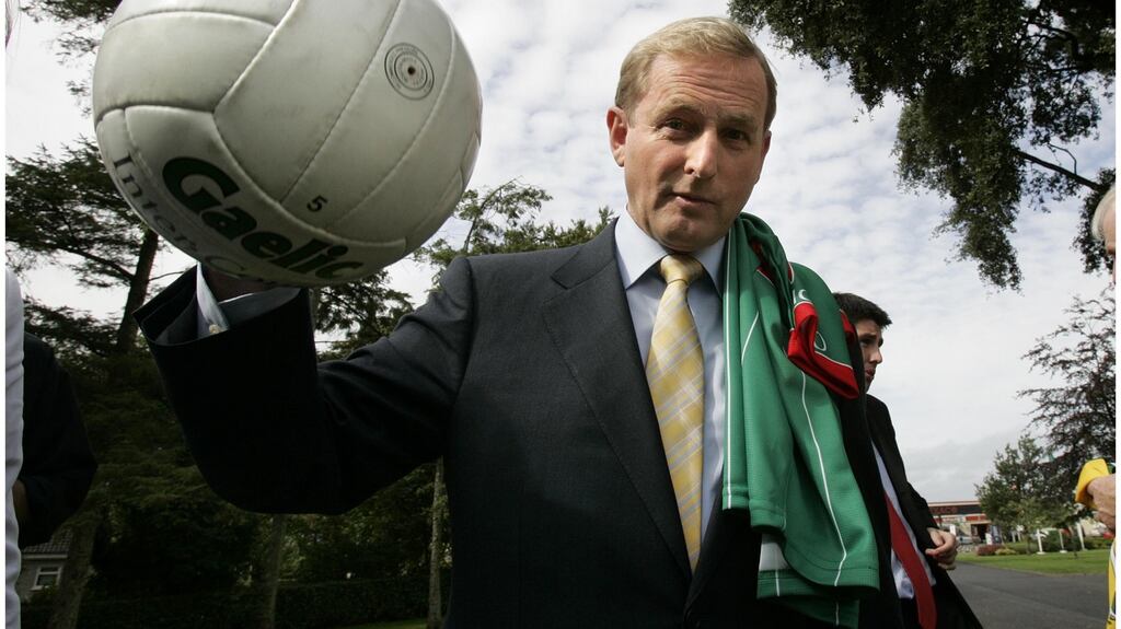 Still waiting for the Sam Maguire: Enda Kenny in 2006 with Mayo jersey and ball. Photograph: Dara Mac Dónaill