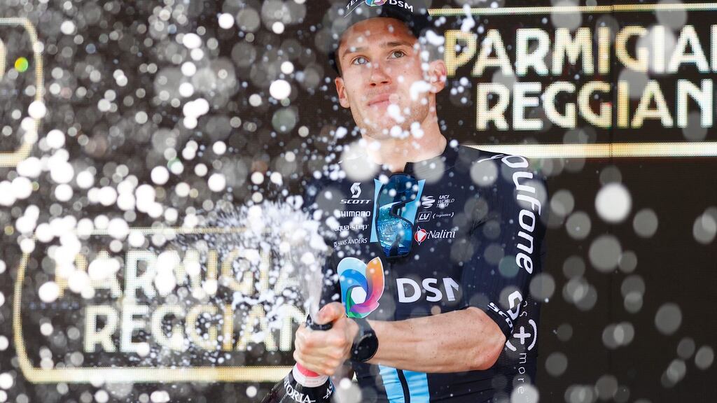 Team DSM’s Italian rider Alberto Dainese celebrates on the podium after winning the 11th stage of the Giro d’Italia. Photograph: Getty Images