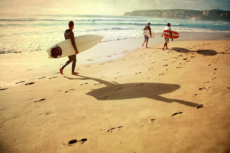 Surfers on Manly Beach, Sydney. Photograph: Jackie Cooper/Getty Images