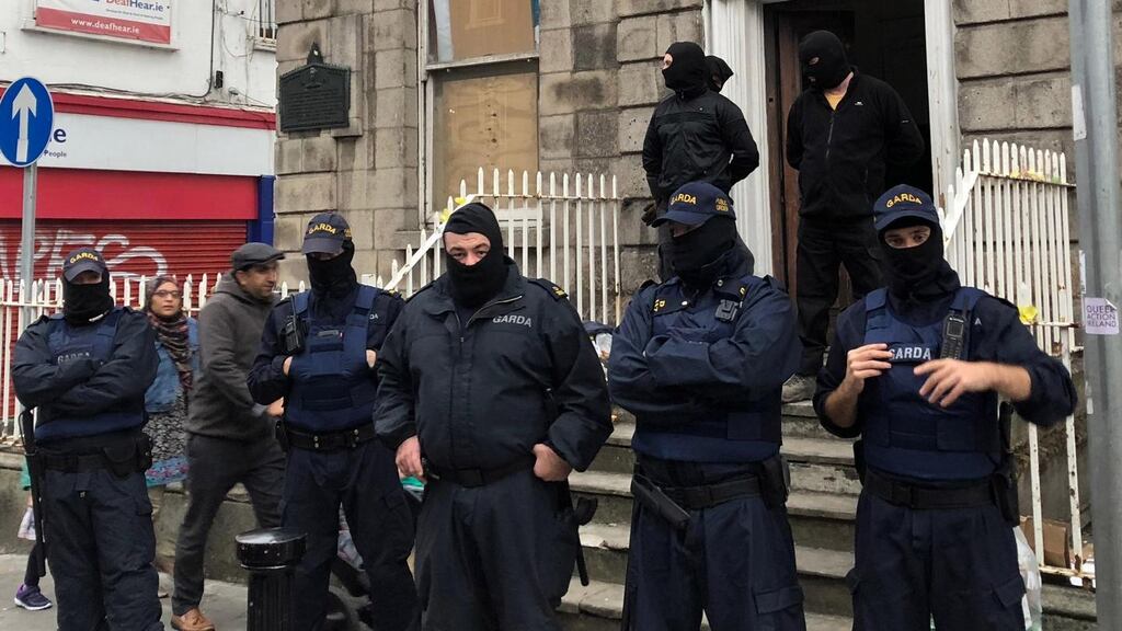 Housing activists were removed by masked gardaí from a Dublin city centre property that they had been occupying for the last three weeks. Photograph: Jack Power/The Irish Times