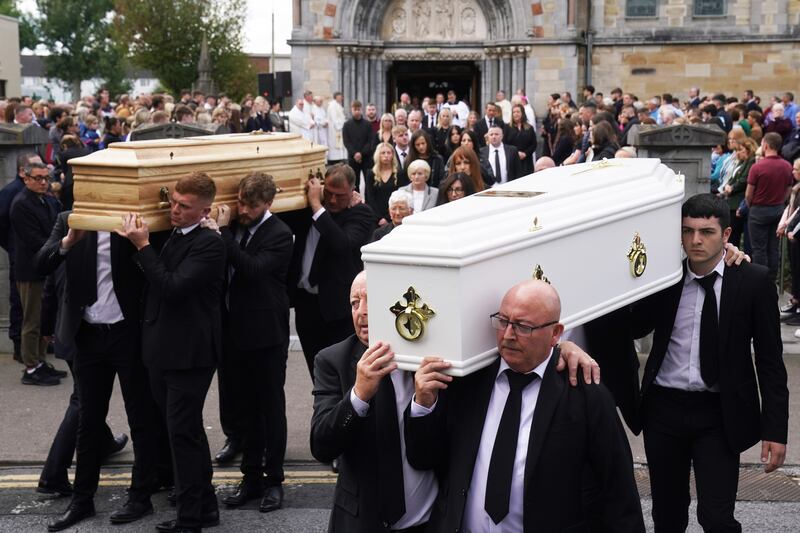 Paul McSweeney (right) carries the white coffin of his daughter Grace in Clonmel, Co Tipperary. Photograph: Brian Lawless/PA Wire