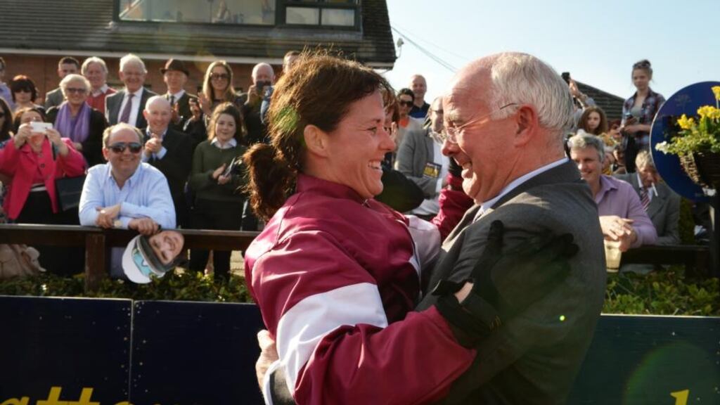 Katie Walsh celebrates with her father Ted after winning the Irish Grand National on Thunder and Roses at Fairyhouse, yesterday. Photograph: Cyril Byrne / The Irish Times