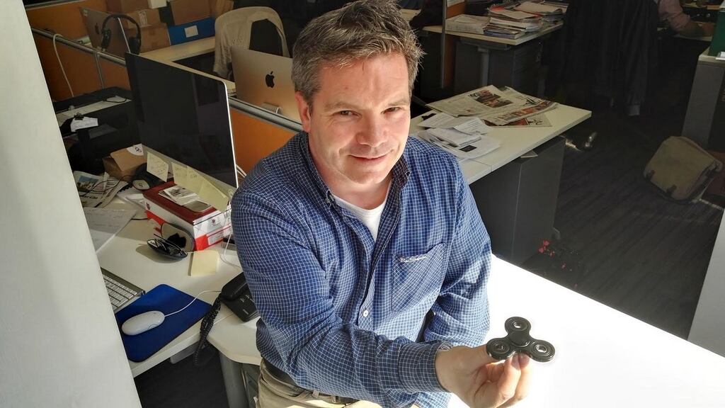 Irish Times reporter Ronan McGreevy demonstrates the intricacies of correctly handling a fidget spinner.