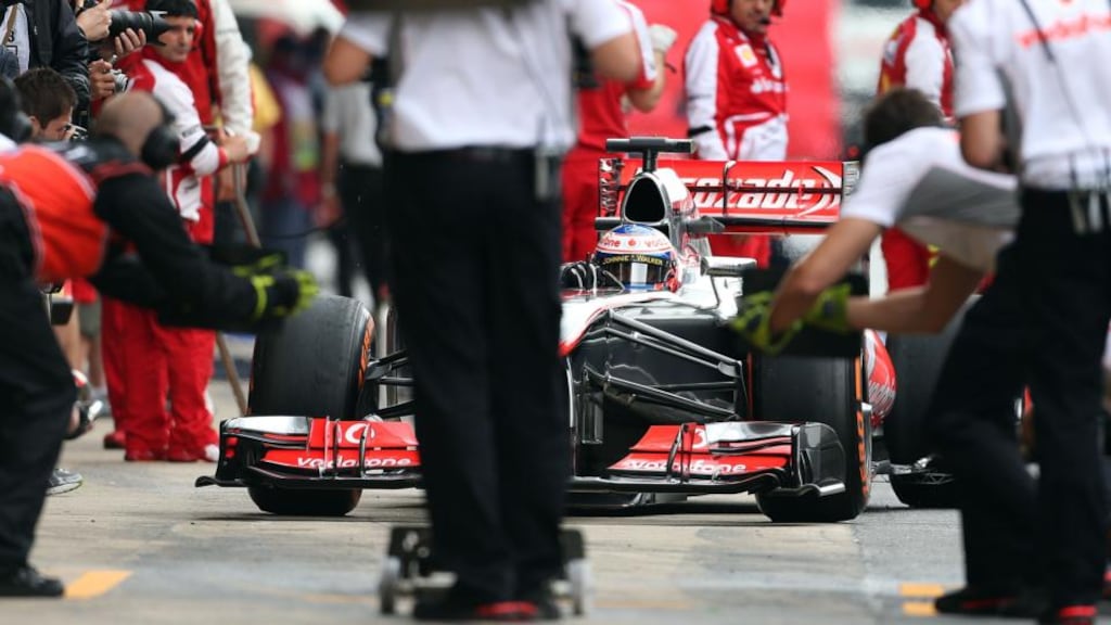 McLaren Mercedes driver Jenson Button comes in to the pits during practice at the Circuit de Catalunya, Barcelona. Photograph: David Davies/PA Wire