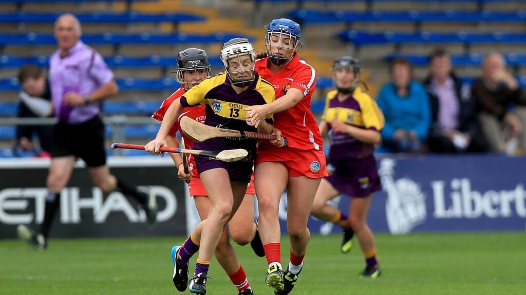 Wexford’s Kate Kelly with Orla Cronin of Cork Liberty Insurance Senior Camogie Championship Semi-Final, Semple Stadium, Tipperary. Photo: Donall Farmer/Inpho