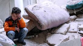 Syrian forces drop barrel bombs on rebel town, killing at least 50