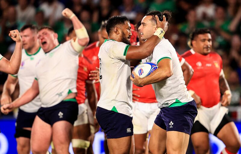 Bundee Aki congratulates James Lowe after scoring a try in the victory over Tonga in the group clash at the Stade de la Beaujoire, Nantes. Photograph: Dan Sheridan/Inpho