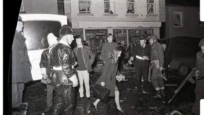 A doctor walks through soldiers at the scene in Belturbet, Co Cavan, following the bombing in December 1972. Photograph: Paddy Ronaghan
