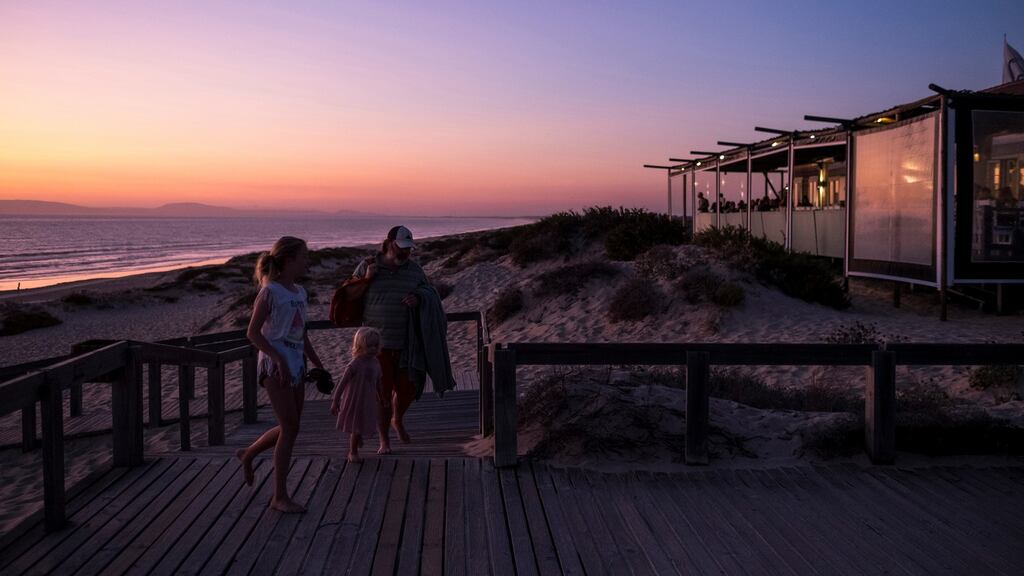 A family arrives at the beachside Sal restaurant on Pego beach in Comporta, Portugal. Photograph: Daniel Rodrigues/New York Times