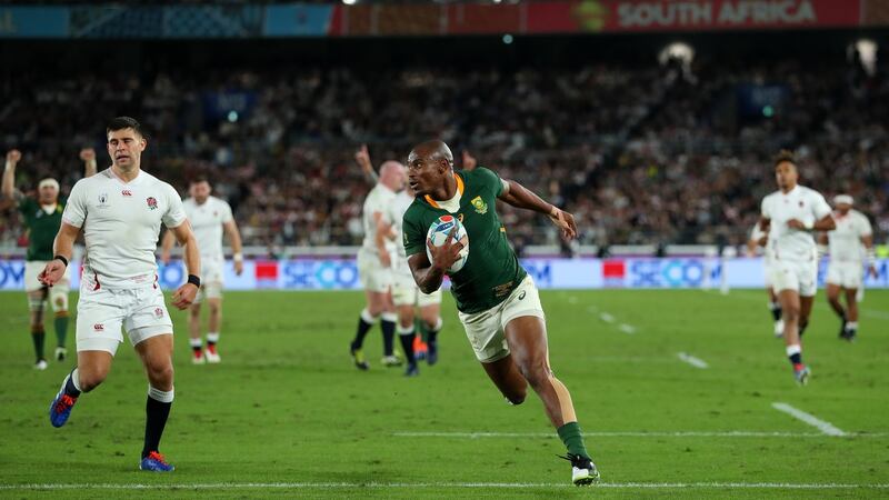 Makazole Mapimpi of South Africa breaks through to score his team’s first try during the Rugby World Cup final victory over England at the International Stadium Yokohama in Yokohama, Kanagawa, Japan. Photograph: Dan Mullan/Getty Images