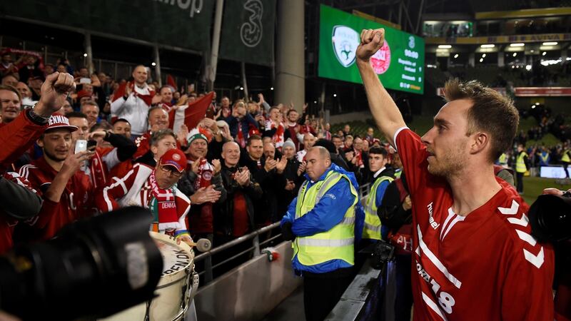 Denmark’s Christian Eriksen celebrates with fans after they beat Ireland at the Aviva stadium to qualify for the World Cup. Photo: Clodagh Kilcoyne/Reuters