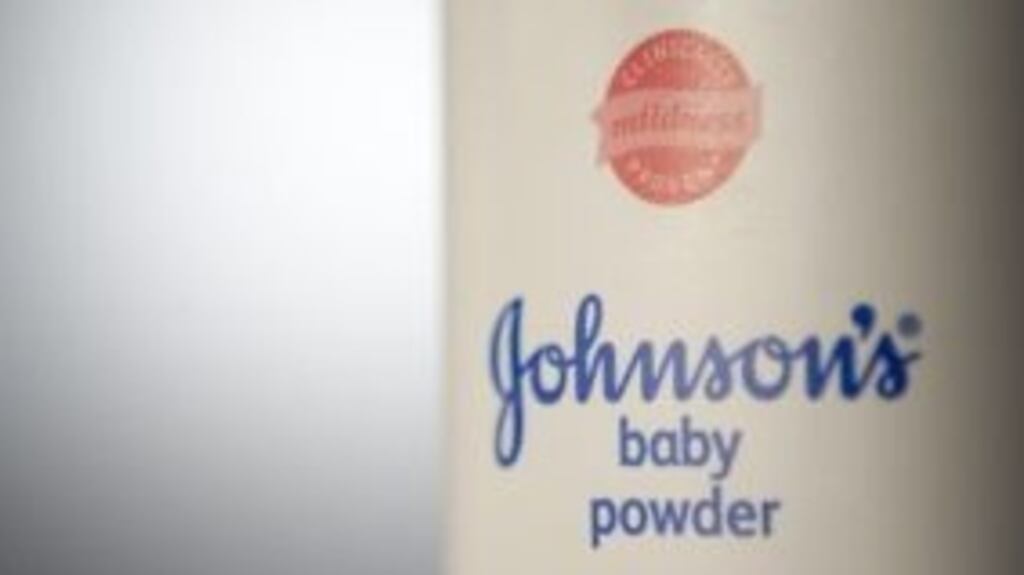Johnson & Johnson shares hit a record high of $125.75, before edging back fractionally.