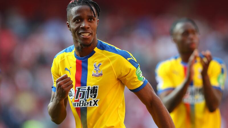 Wilfried Zaha celebrates Crystal Palace’s victory over Arsenal at the Emirates. Photograph: Warren Little/Getty