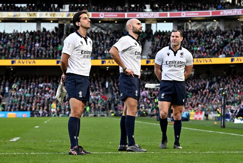 Assistant referee Gianluca Gnecchi, referee Andrea Piardi and assistant referee Karl Dickson await a TMO review which resulted in a penalty try for Wales against Ireland at the Aviva Stadium. Photograph: Charles McQuillan/Getty Images