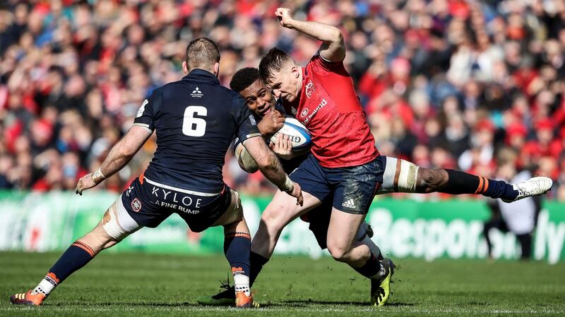 Munster’s Rory Scannell is tackled by Edinburgh’s Viliame Mata and John Barclay. Photograph: Dan Sheridan/Inpho