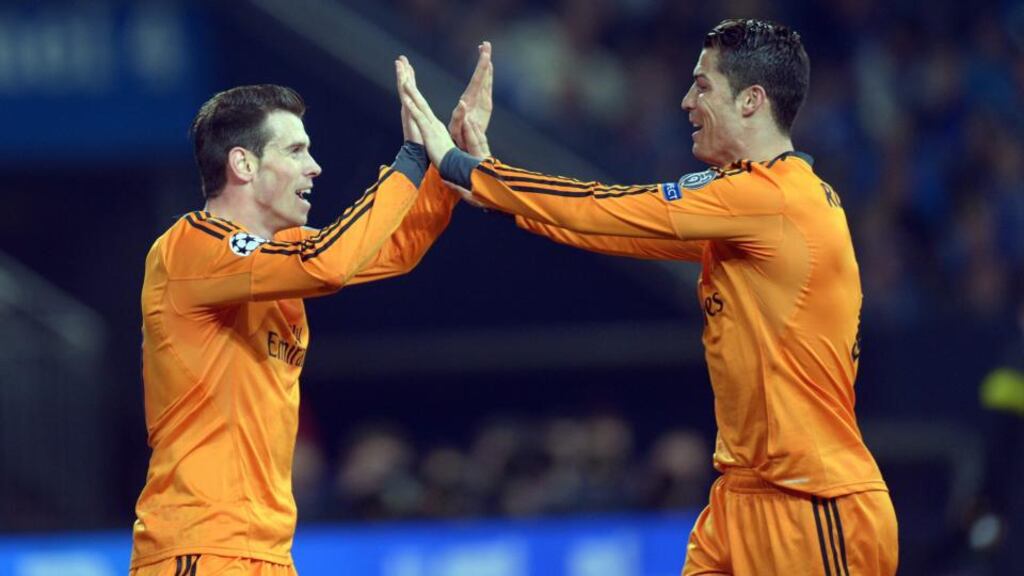 Gareth Bale celebrates his first goal against Schalke with Cristiano Ronaldo. Photograph: Federico Gambarin/EPA