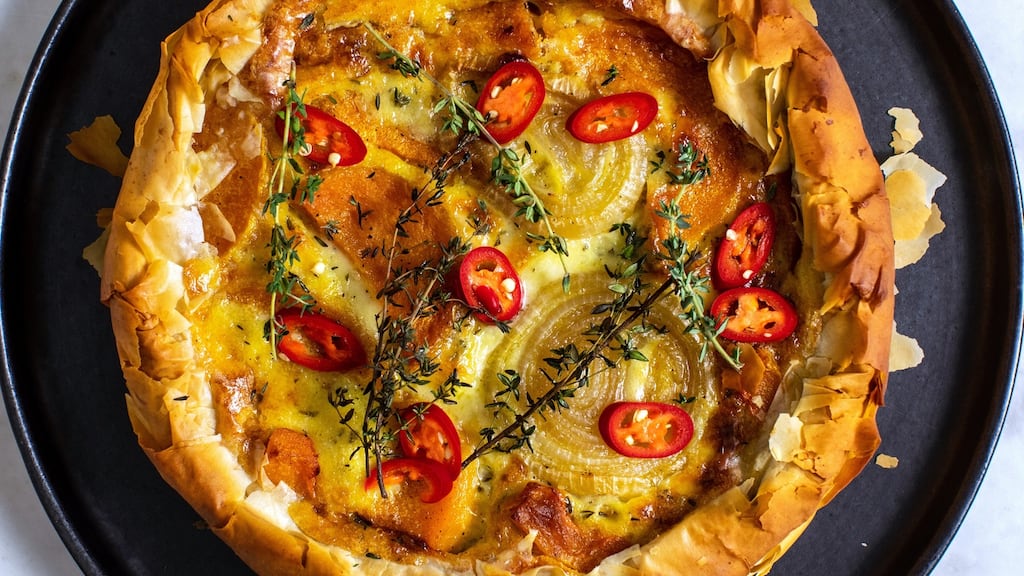 Butternut squash and fondue pie with pickled red chillies. Photograph: Andrew Scrivani/The New York Times