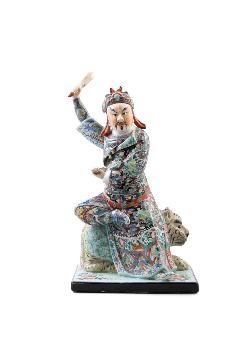 Rare famille rose porcelain figure of Guandi, the god of war, seated on a tiger (€800-€1,200)