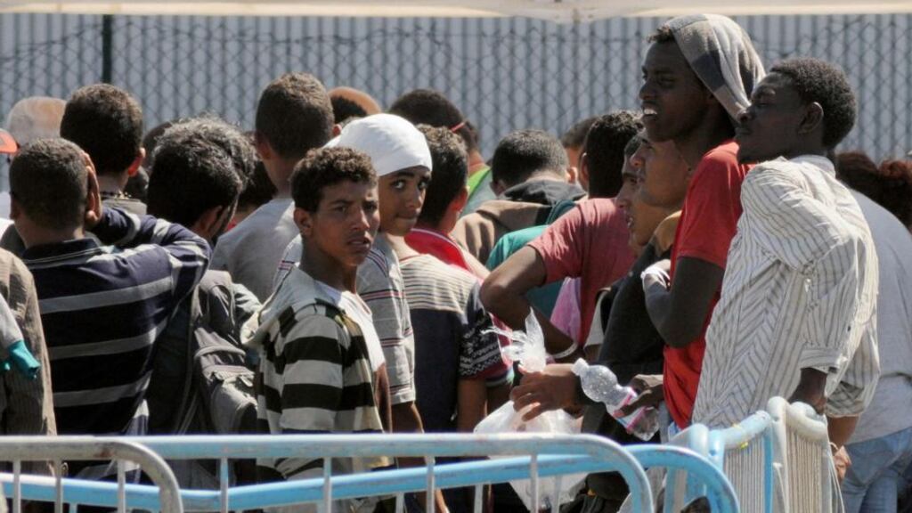 Migrants wait in Catania harbour in Italy after being rescued by the Italian coast guard on August 26th, 2015. Photograph: Dario Azzaro/AFP/Getty Images