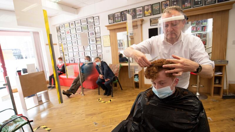 Gerry McKeever cuts Paul Hannigan’s hair in Gerry’s Barbers  in Letterkenny, Co. Donegal. Photograp: Joe Dunne