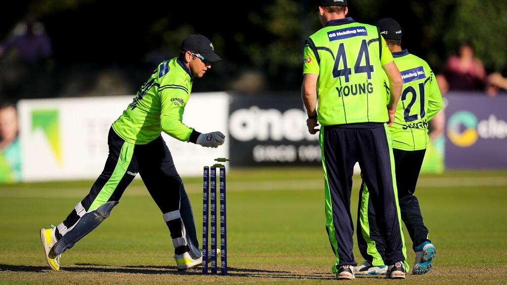 Ireland captain and wicketkeeper Gary Wilson takes the bails off to run out Scotland’s Craig Wallace and complete a one-run win to seal the GS Holding T20 Tri-Series in Malahide. Photograph: Oisín Keniry/Inpho