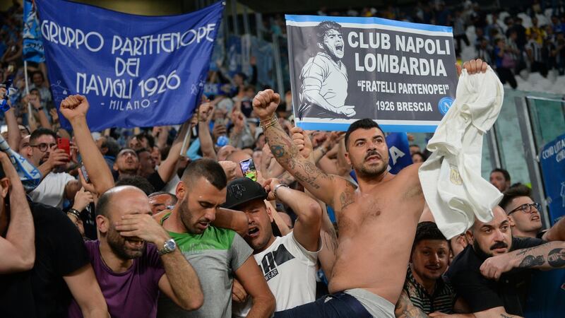 Napoli fans celebrate after the match. Photo: Massimo Pinca/Reuters