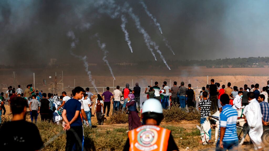Tear gas canisters fired by Israeli forces landing amidst protesters along the border with Israel east of Khan Yunis in the southern Gaza Strip. Photograph: Said Khatib/AFP/Getty Images