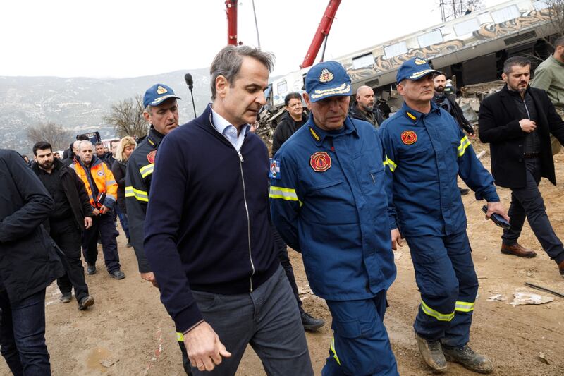 Greek prime ministe Kyriakos Mitsotakis (centre) tours the site of the crash on Wednesday. Photograph: Konstantinos Tsakalidis/Bloomberg